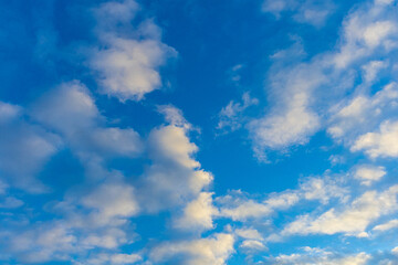 Fototapeta na wymiar evening clouds in the blue sky