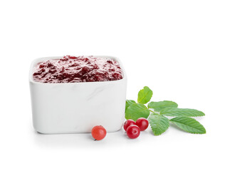Bowl of tasty cranberry jam on white background