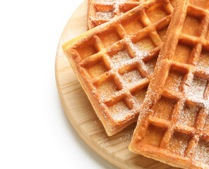 Board with yummy Belgian waffles on white background, closeup
