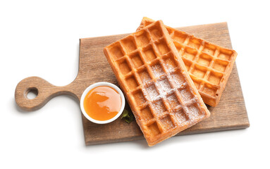 Board with tasty Belgian waffles and honey on white background