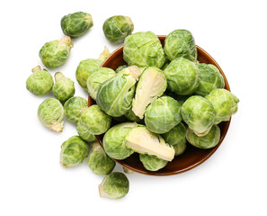 Bowl with fresh Brussels cabbage on white background