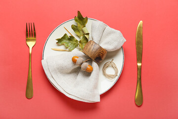 Stylish autumn table setting on color background
