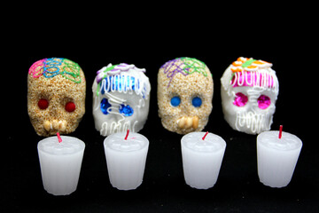 Candy in the shape of a skull made of sugar and amaranth to decorate the offering with candles for the Day of the Faithful Dead and all the saints that is celebrated in Mexico
