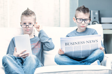 Spoof of two young boys wearing glasses posing as businessmen