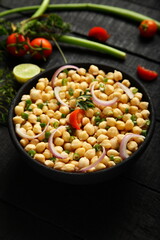 Homemade delicious chickpeas salad with herbs.