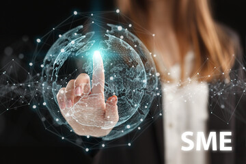 Obraz premium Business, Technology, Internet and network concept. Young businessman working on a virtual screen of the future and sees the inscription: SME