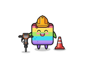 road worker mascot of rainbow cake holding drill machine