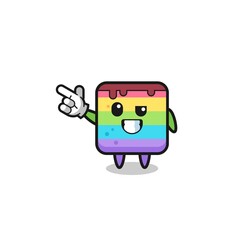 rainbow cake mascot pointing top left
