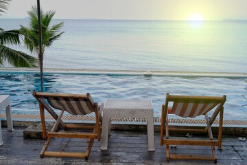 Fototapeta na wymiar table and chairs on the beach