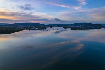 Fototapeta premium Sunrise and cloud reflections waterscape