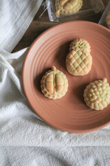 Taiwanese Pineapple Cakes, famous sweet delicious dessert food with tea, close up, copy space design.
