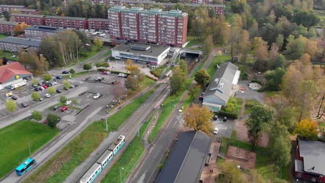 Aerial, tram arriving at station in Gardsas Torg. Gothenburg, Sweden.