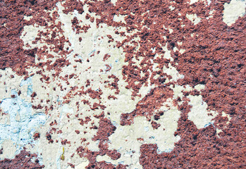 Red-orange painted wall with cinder block texture. Abstract interior background.