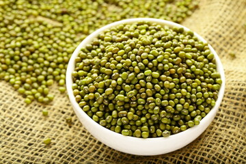 Bowl of organic mung beans, Asian vegan diet foods.