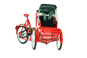 red souvenir tricycle on white background.