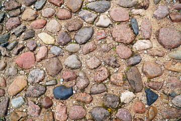 Texture of stone paving on the road