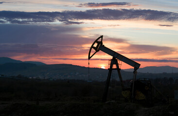 oil pump on sunset.