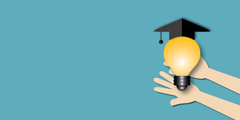 Hands holding light bulb with graduation cap on blue background. Concept for studying, educational success, education and e-learning. Space for the text. Paper art design style.