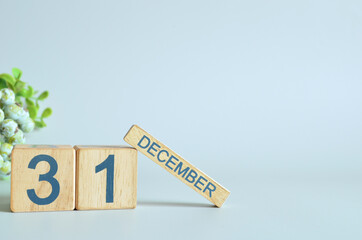 December 31, Calendar cover design with number cube with green fruit on blue background.

