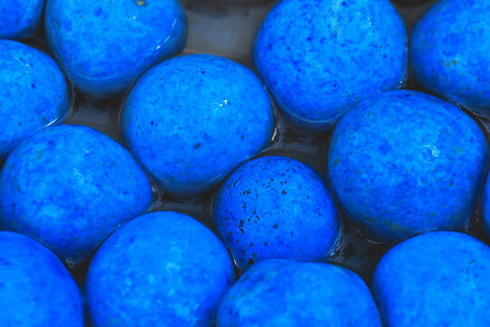 Closeup of blue balls in the water