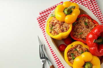 Concept of tasty food with stuffed pepper on white background