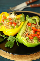 Concept of tasty food with ​stuffed pepper on wooden background