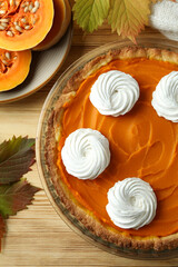 Obraz na płótnie Canvas Concept of tasty food with pumpkin pie on wooden background