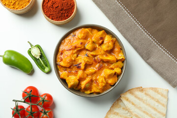 Concept of tasty food with chicken tikka on white background