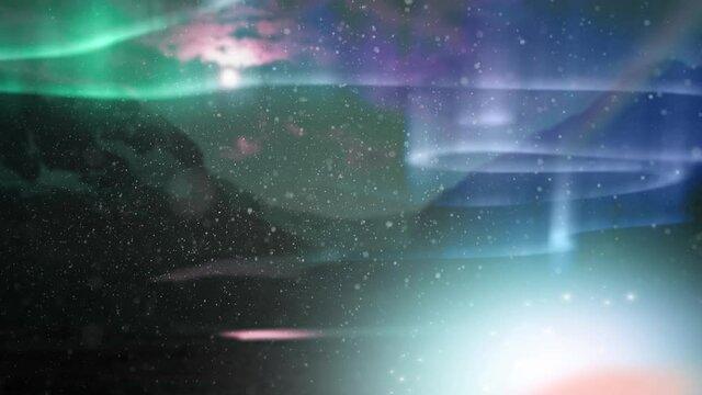 Animation of snow falling at christmas over aurora and winter scenery