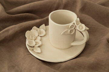 Fototapeta na wymiar Ceramic mug flower tree figures on a white background.