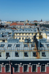 RUSSIA, Saint Petersburg: Scenic aerial cityscape view of the sunny city roofs and architecture with blue clear sky