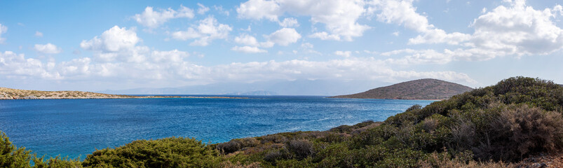 Fototapeta na wymiar panoramic view with clouds from the bay near the sunken city of Olus, on the island of Crete on a sunny day, windy day,