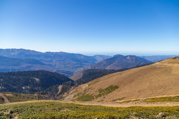 Fototapeta na wymiar Beautiful panorama of the Caucasus mountains on a sunny autumn day
