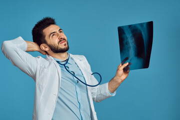 radiologist x-ray examination hospital patient treatment blue background