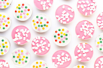 Colorful cupcakes on a white background.