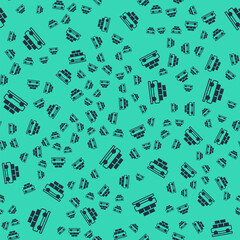 Black Cargo train wagon icon isolated seamless pattern on green background. Full freight car. Railroad transportation. Vector