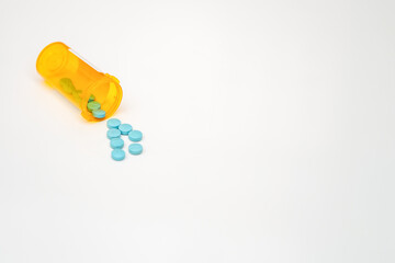 pills drug medicine tablets pour out bottle for supplement vitamin healthcare illness treatment concept in pharmacist open and label then spill them for prescribe