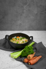 Freshly cooked chicken soup and ingredients