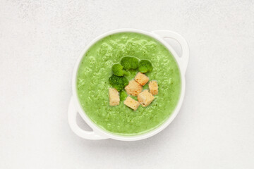 Bowl with delicious broccoli soup on table. Top view. Vegetarian and vegan, baby food