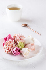 Breakfast of zephyr roses with a cup of tea.