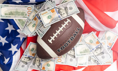 rugby ball and dollars on american flag