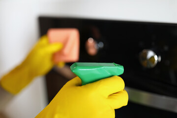 Woman in yellow protective gloves