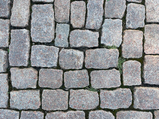 Granite paving stones on the city street - top view