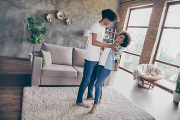 Full size photo of young black couple happy positive smile have fun dance music girlfriend boyfriend indoors