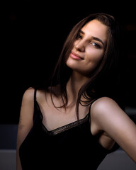 Fashion woman portrait with contrast lighting in the city