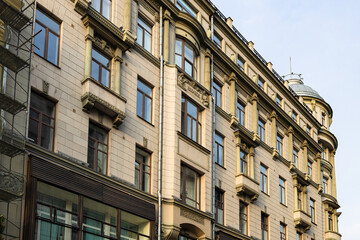 Fototapeta na wymiar tiled facade of old urban house on Kuznetsky Most 21 street in Moscow city in evening. This former profitable house of First Russian Insurance Company was built in 1905-1906