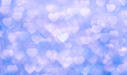 Background bokeh in the form of hearts in blue. Copy space for text. The concept of romance and love. Valentine's Day. Shiny texture background. Festive background.