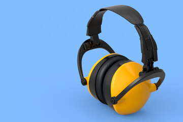 Protective yellow earphones muffs isolated on a blue background