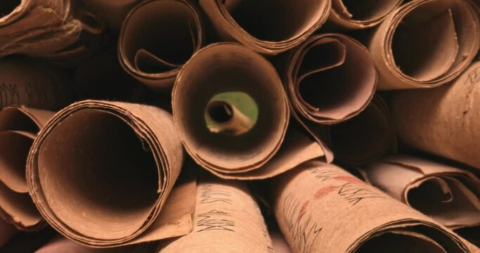 Stack of vintage scrolls. Old scroll library.