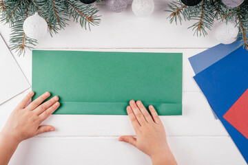 Step-by-step Greeting card 3D Christmas tree tutorial. Step 5: And fold in half again